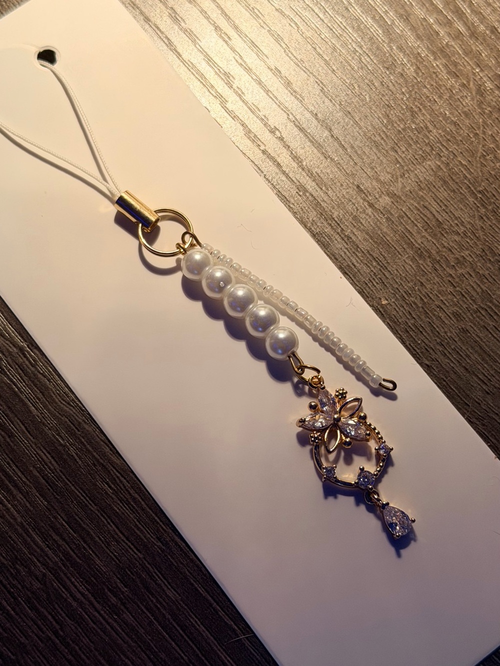 Elegant Pearl and Gold Floral Charm Phone Strap - White